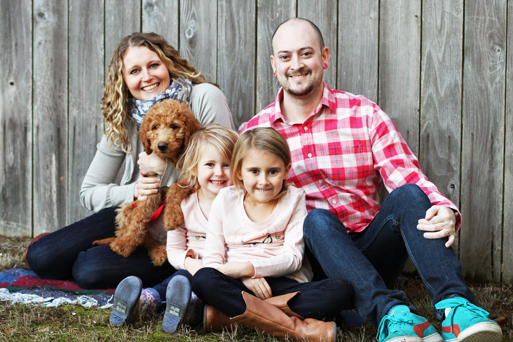 family with labradoodle dog