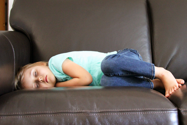 girl sleeping on couch