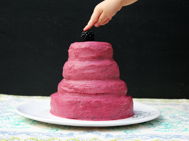 black beluga lentil cake with blackberry frosting