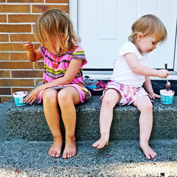 kids eating ice cream on front step