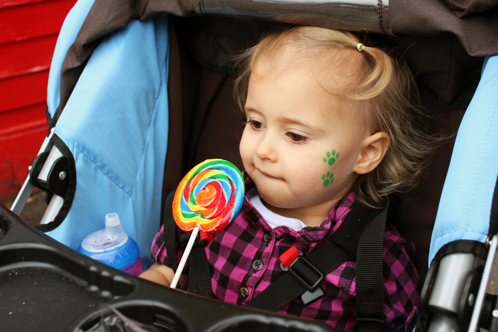 girl eating giant lollipop