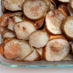 sliced pears and yams layered in a dish