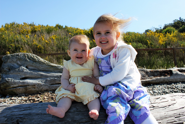 kids at beach with scotch broom